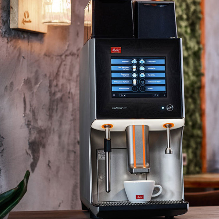 Melitta Cafina XT7 Bean To Cup Coffee Machine on a countertop